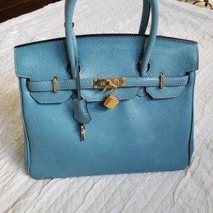 Turquoise Italian leather status handbag.